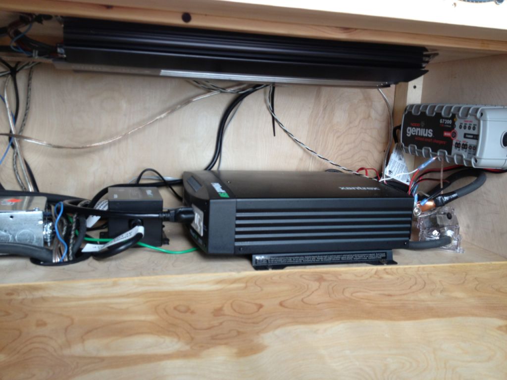 Xantrex sw 2000 pure sine wave inverter,  Arc Audio 1200.1 amp for the Subwoofer, Shore power runs into a "genius " battery charger for the house battery