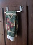 Kitchen Cabinet Towel Bar. This one just hangs over the door. It has rubber pads where it touches wood. Got it at Camping World. It is identical to...